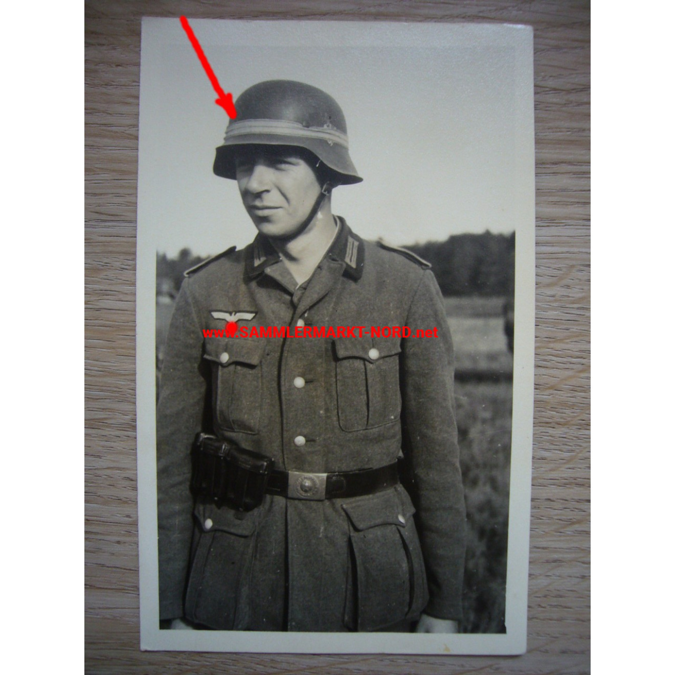 Wehrmacht soldier with manoeuvre ribbon on steel helmet