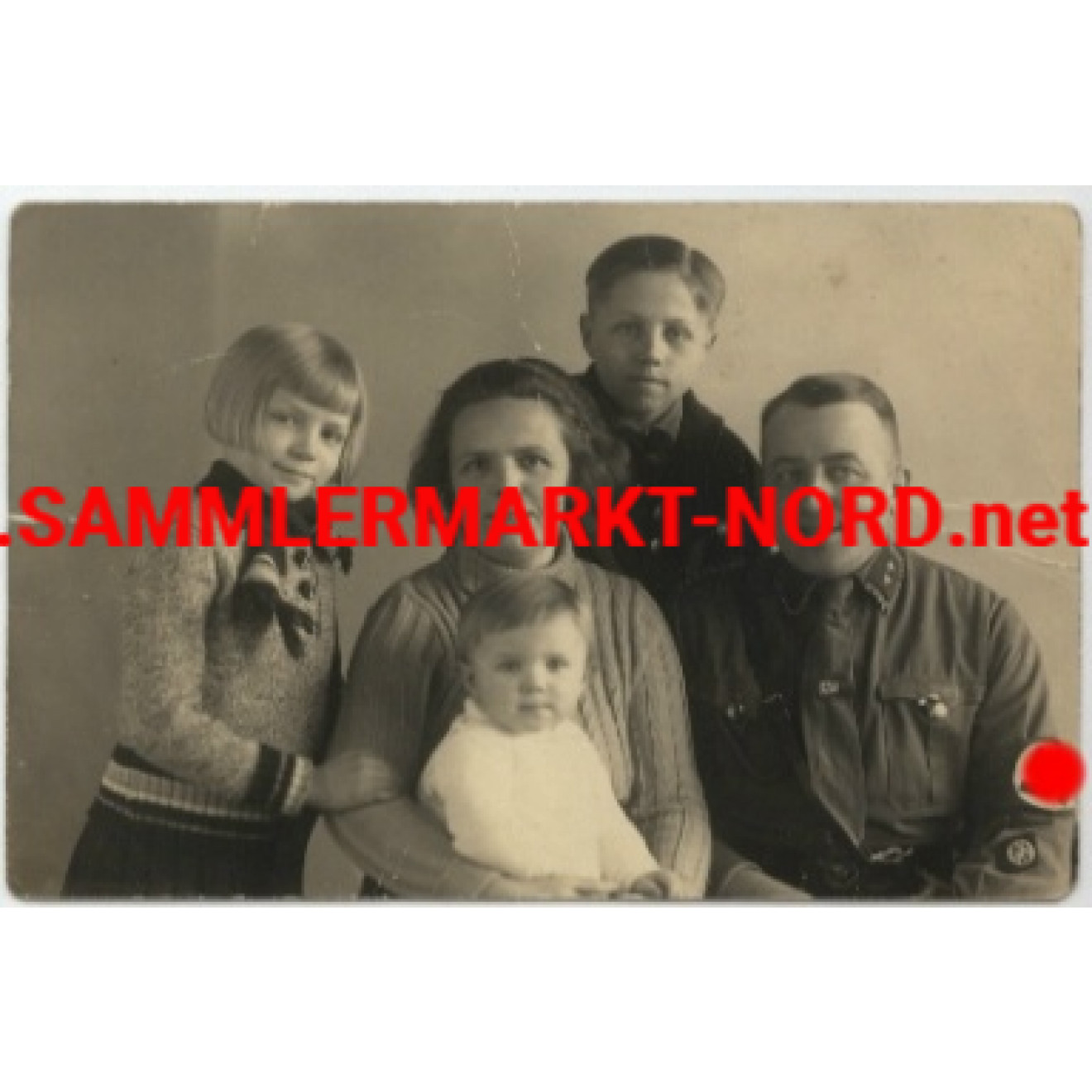 NSKK leader with insignias and NSDAP party badge