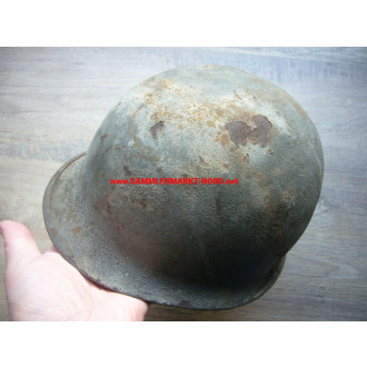 US Army steel helmet with rough camouflage